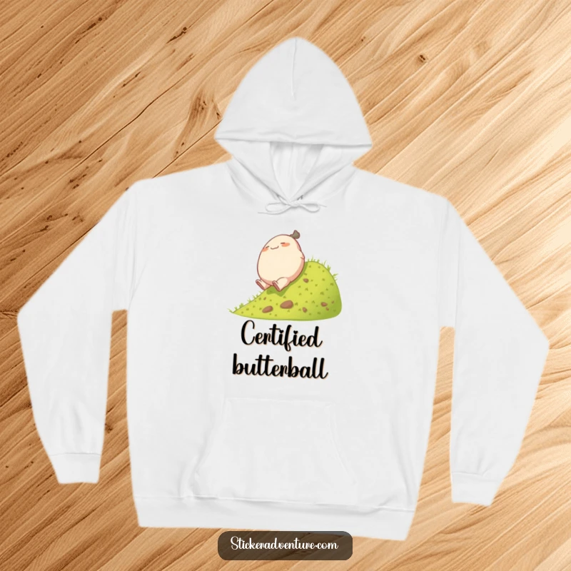 Funny rolling character hoodie, showing a plump character having a joyful, playful tumble down a grassy hill.